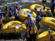 Rafters use a rebuilt take-out ramp from the White Salmon River on Wednesday at Northwestern Lake Park, a few miles upstream of Condit Dam.