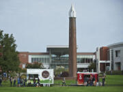 Hungry students, faculty and staff order lunch from The Mighty Bowl, left, and Chewy's Burritos &amp; More on the Clark College campus on Wednesday.