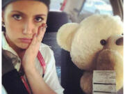 Scarlett Zibritovsky got slammed with a $260 traffic ticket for driving in an HOV lane with a oversized teddy bear riding shotgun.