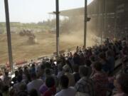 Drivers entertain a full house during the afternoon Monster Truck Show at the Clark County Fair on Saturday.