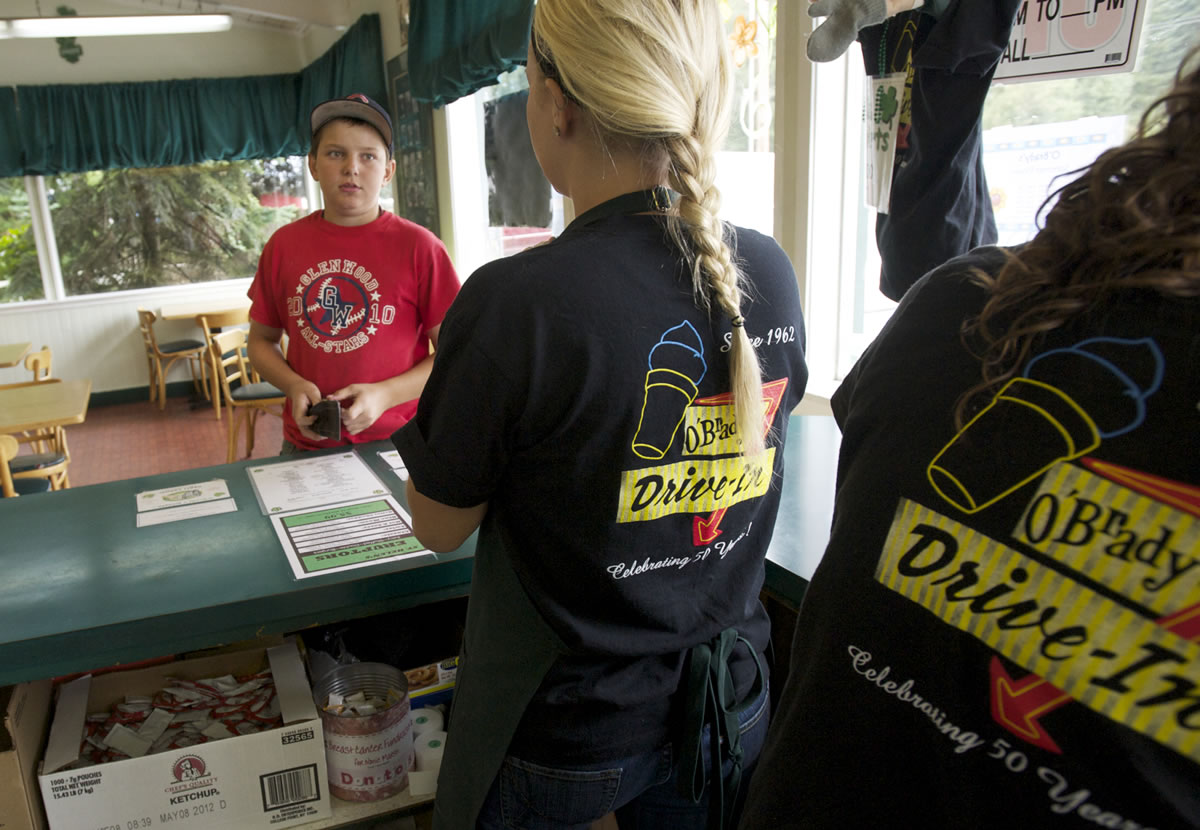 Steven Lane/The Columbian
Blake Robb, 12, from Vancouver, orders an ice cream cone Wednesday at O'Brady's restaurant. The Dollars Corner fixture expects to close at that location this year, before a planned widening of state Highway 502 begins in earnest in 2013.