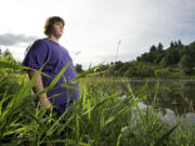 Taylor Olson, 17, stands beside Salmon Creek in Vancouver on Thursday.