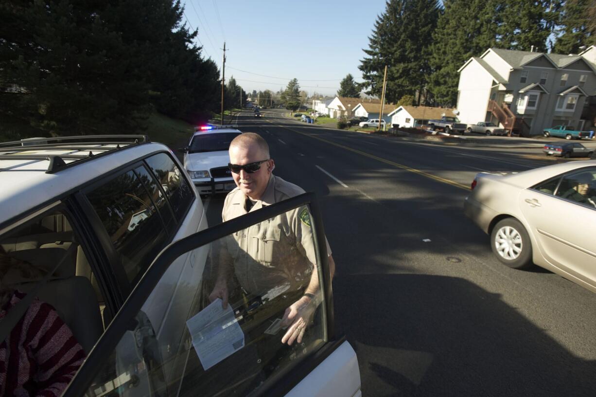 Photos by Steven Lane/The Columbian
Clark County Sheriff's Deputy Kevin Gadaire patrols the area around Highway 99 near Minnehaha Street.