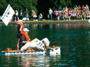 Hazel Dell: Josiah Winiecki and his grandfather Tad paddle in a vessel fashioned from milk cartons at the annual Dairy Farmers of Oregon Milk Carton Boat Race held June 9 at Westmoreland Park in Portland.