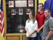 Brush Prairie: Prairie High School students Samantha Willson, from left, Casey McNicholas and Brett Udy, unveiled a school memorial June 13 they created to honor three local military members who died while serving in the Middle East.