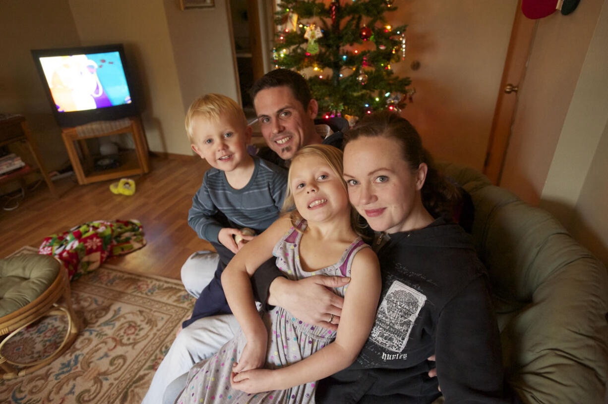 Chandar Pass, 33, and Katie Padgett, 34, get ready for Christmas with their children, Daelan Pass, 2, and Kendra Pass, 5.