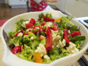 The Puyleart family uses fresh produce, purchased through community supported agriculture programs at Clark County farms, to make a dinner salad at their La Center home.