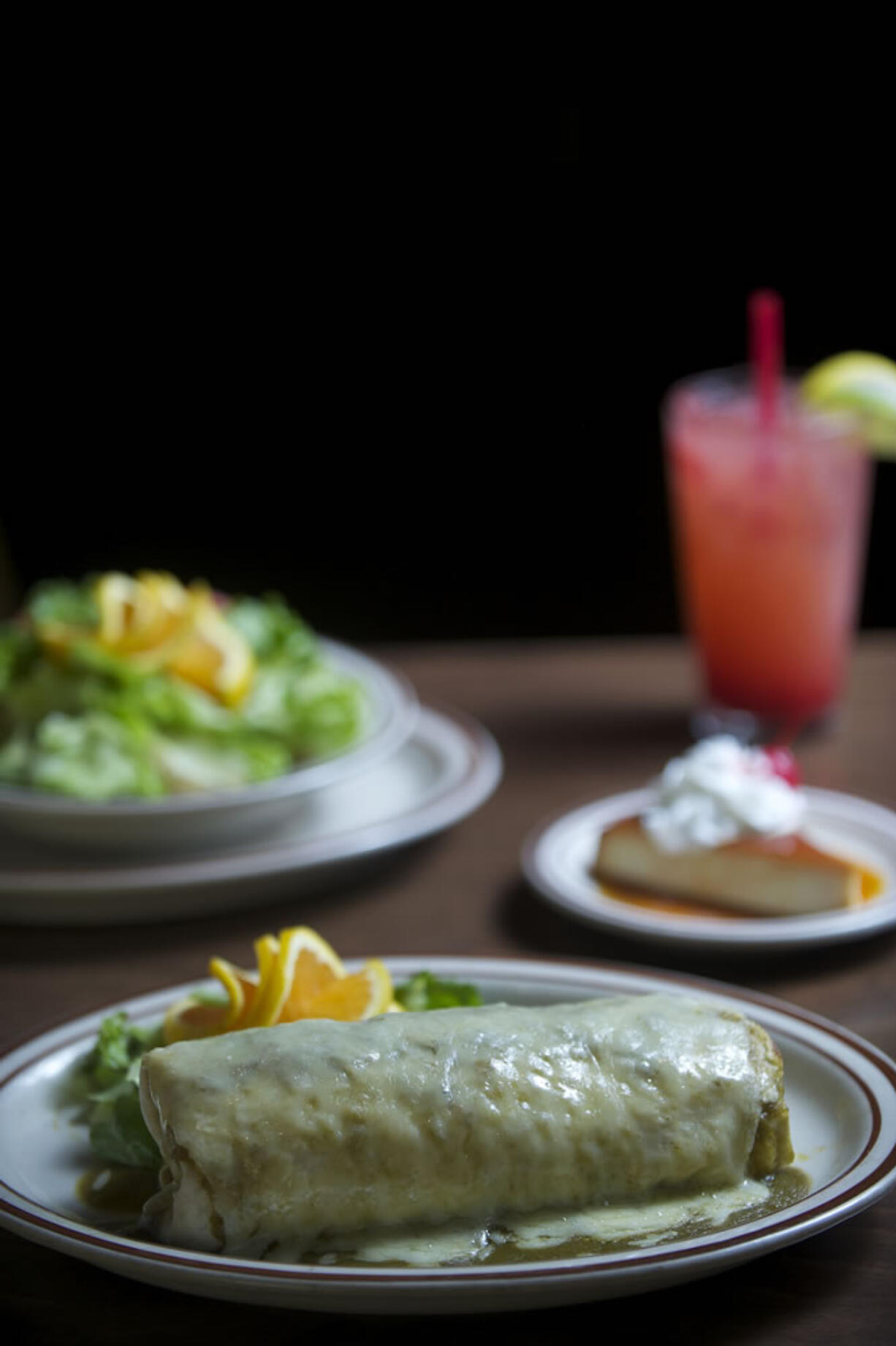 The puerco verde burrito, the chicken bowl and flan at La Solera in Battle Ground.