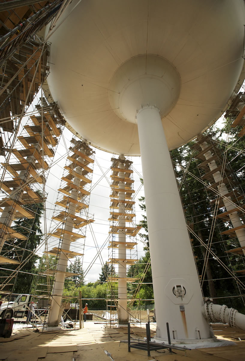 Workers from HCI Industrial &amp; Marine Coatings, Inc., put up scaffolding around the city of Vancouver's Water Tower 7. Crews will repaint the 115-foot-tall water tower this year, in part to prevent corrosion and extend its life. The steel tower is one of 11 enclosed water stations in the city that draw drinking water from underground aquifers.