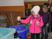 Battle Ground: Students at the Maple Grove K-8 School recycle items in the cafeteria.