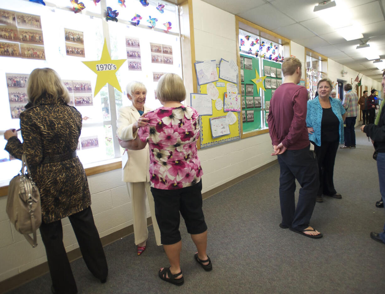 Judie Loveall, center left, current secretary at George C.