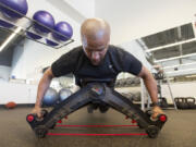 Nautilus employee Dave Patania demonstrates the Bowflex Upper Cut on Monday.