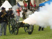 1st Oregon Volunteer Infantry re-enactors fire an 1841 Mountain Howitzer Cannon during a soldiers bivouac demonstration at the Vancouver Barracks on Memorial Day.