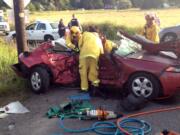 Battalion Chief Brett Graham/Clark County Fire &amp; Rescue
Firefighters help extricate two women trapped in a sedan after a Monday evening T-bone accident at an intersection in Ridgefield.