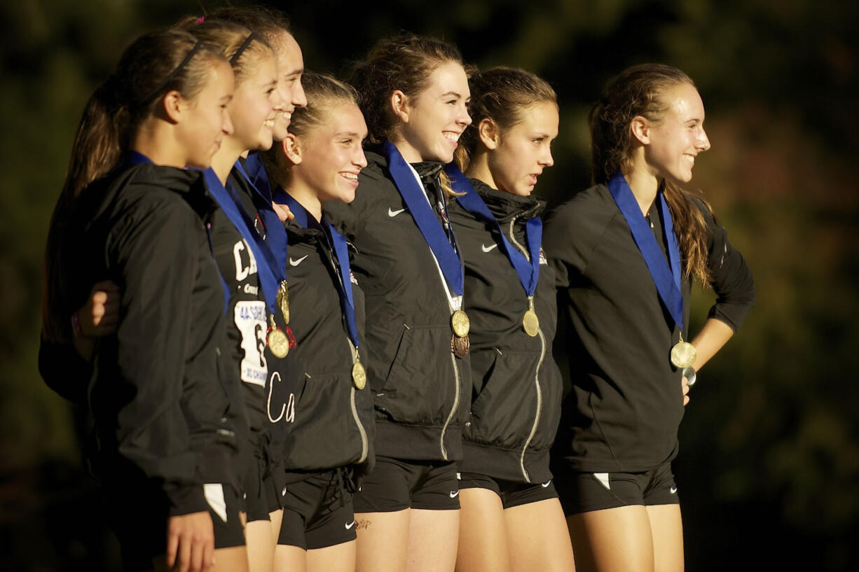 The Camas High School girls cross country team is recognized for winning the 4A district team competition Wednesday at Lewisville Park in Battle Ground.