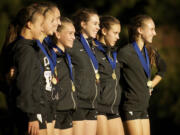 The Camas High School girls cross country team is recognized for winning the 4A district team competition Wednesday at Lewisville Park in Battle Ground.