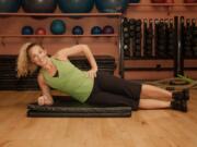 Sherri McMillan demonstrates a side abdominal stabilizing exercise.