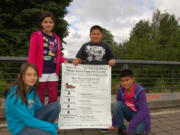 Burnt Bridge Creek: Fifth graders Emily Blakeman (left), Amayrani Bourgoin, Noah Bachman and Refujio Flores Perez want you to stop feeding the ducks.