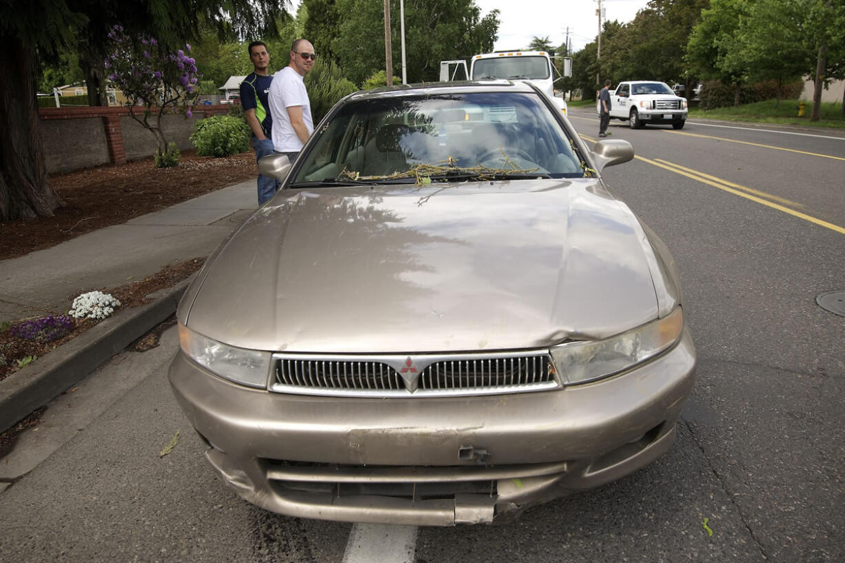 Tyffany Mitchell's 1999 Mitsubishi Galant was damaged by a falling tree on Fruit Valley Road Monday afternoon during her drive home from work.