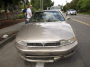 Tyffany Mitchell's 1999 Mitsubishi Galant was damaged by a falling tree on Fruit Valley Road Monday afternoon during her drive home from work.