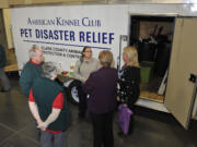 Visitors to the Greater Clark County Kennel Club&#039;s dog show last weekend chat at the unveiling of Clark County&#039;s pet disaster relief trailer at the Clark County Event Center at the Fairgrounds in Ridgefield. The 16-foot trailer can house 65 animals in an emergency.