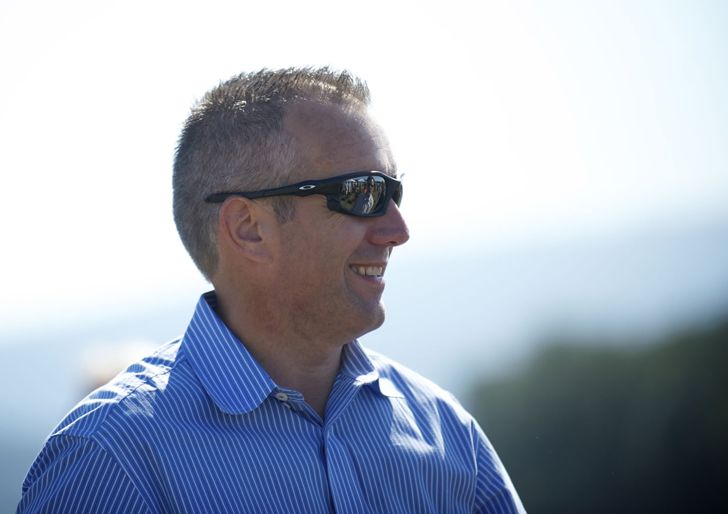 The Port of Camas-Washougal Executive Director David Ripp visits with attendees of the official groundbreaking for the Steigerwald Commerce Center on Thursday.