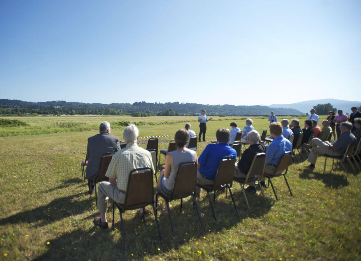 The Port of Camas-Washougal Executive Director David Ripp, center, speaks during the official groundbreaking for the Steigerwald Commerce Center on Thursday.