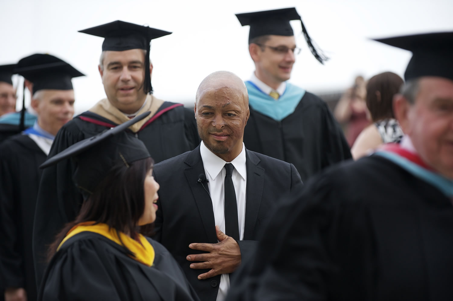 Keynote speaker J. R. Martinez talks to Rhona Sen Hoss, outgoing chair of the Clark College Board of Trustees.