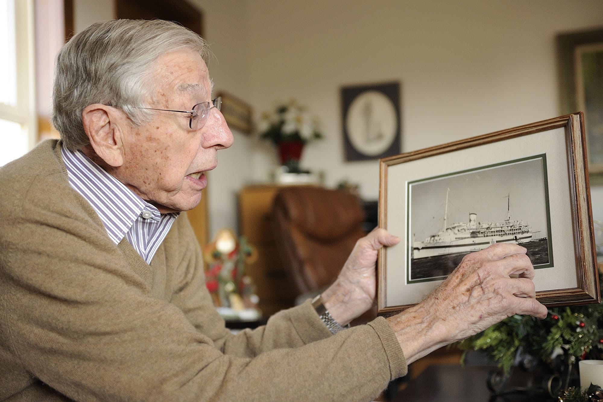 Pearl Harbor survivor Ralph Laedtke shows the quarterdeck entry where casualties picked up by rescue boats were taken aboard the USS Solace on Dec. 7, 1941. The Solace originally was built as a passenger ship, the SS Iroquois.