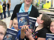 Washougal: Third-grade teacher Landa Blackburn and students at Gause Elementary receive donated dictionaries Nov.