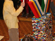 Esther Short: Mendel Greenberg places candles on a Lego menorah on Dec. 9 at the Hilton Vancouver Washington.