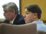 Dennis Wolter of Vancouver listens to attorneys during his trial on a charge of aggravated first-degree murder in the slaying of his girlfriend, Kori Fredericksen.