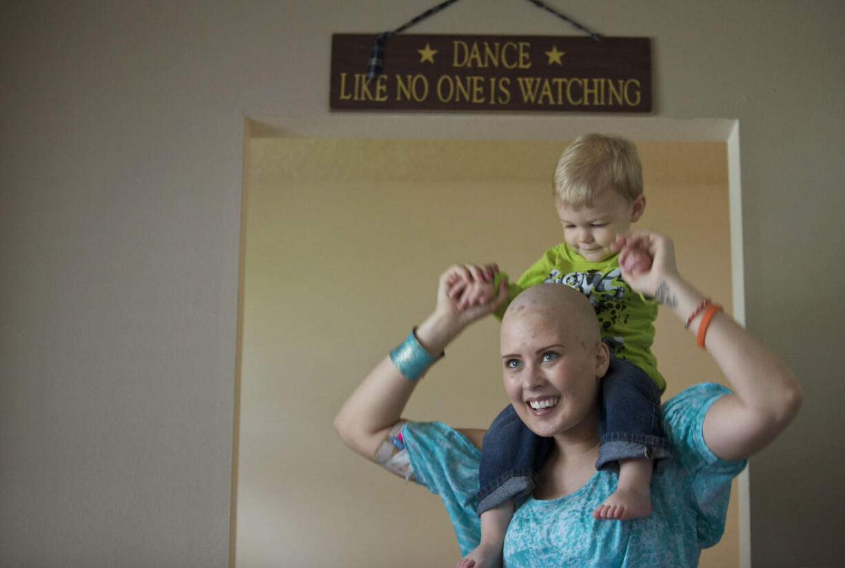 Liz Rowan spends time with her nephew Wesley Yager, 18 months, at their west Vancouver home Monday.