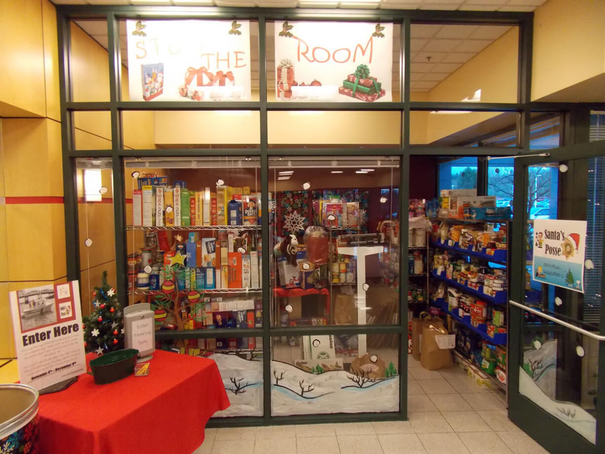 Camas: WaferTech employees filled a conference room with toys and food as part of a Stuff The Room fundraiser for the Santa&#039;s Posse Toy Drive.