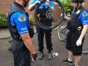 Hudson's Bay: Vancouver Police officers Jeremy Souza, from left, Rick Rich and Holly Musser take part in a bike patrol training course in early June.