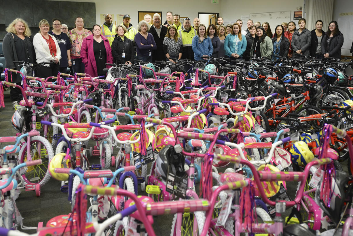 About 150 employee volunteers, social workers and community members built 417 bikes in less than three hours Thursday for Waste Connections&#039; 15th annual Christmas Promise Bike Build. On Friday, volunteers delivered 120 bicycles for foster kids at the Washington State Department of Social and Health Services building in Vancouver.