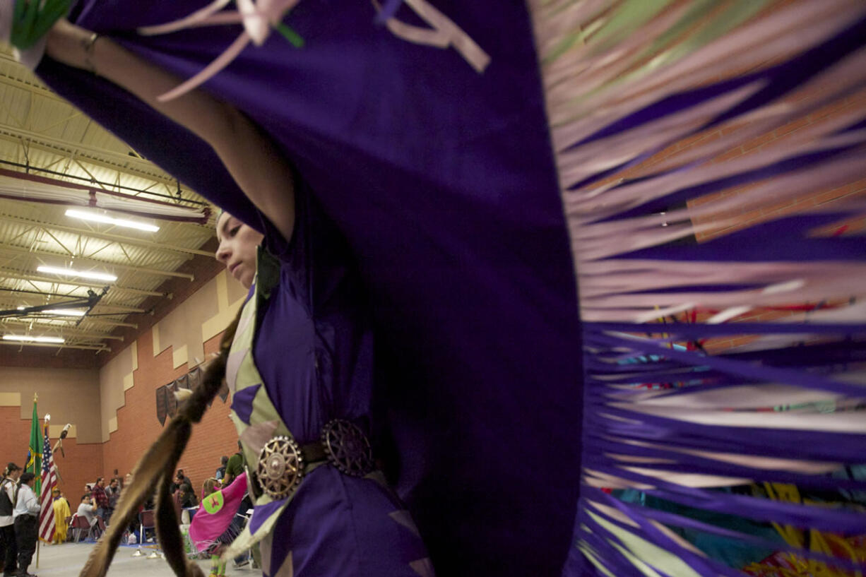 Photos by Steven Lane/The Columbian
Sydney Moore, 18, of Vancouver dances Saturday during the Grand Entry at the Title VII Native American Indian Education Program's annual pow-wow at Covington Middle School in Vancouver.