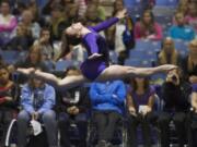 Heritage gymnast Britni Atwell wins the 4A floor excercise at the State Gymnastics Championships in Tacoma, Saturday, February 16, 2013.