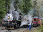 Engineers take a break at the stop on the Chelatchie Prairie Steam Railroad in Yacolt Wa, Saturday Dec 19, 2015.