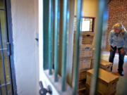 Beth Townsend, who drove the Clark County bookmobile to Yacolt before that program ended, helps set up the new Yacolt Library Express in the former jail and town hall.