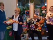 From left, Sharon Luft, Major Susan Nute, Major Michael Nute and Lt. Susan Cassin hold toys that the Salvation Army received after making a last-minute donation plea. Volunteers noticed they were running low on toys earlier this week.