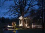 Firefighters respond at the scene of a structure fire Friday morning, Dec. 4, 2015 at 18014 N.E. Fourth Plain Boulevard.