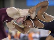 Evergreen's Tekwon Wallace, right, beats Adam Gascoyne from South Kitsap in the 152-pound weight class state quarterfinals of the 4A state wrestling tournament.