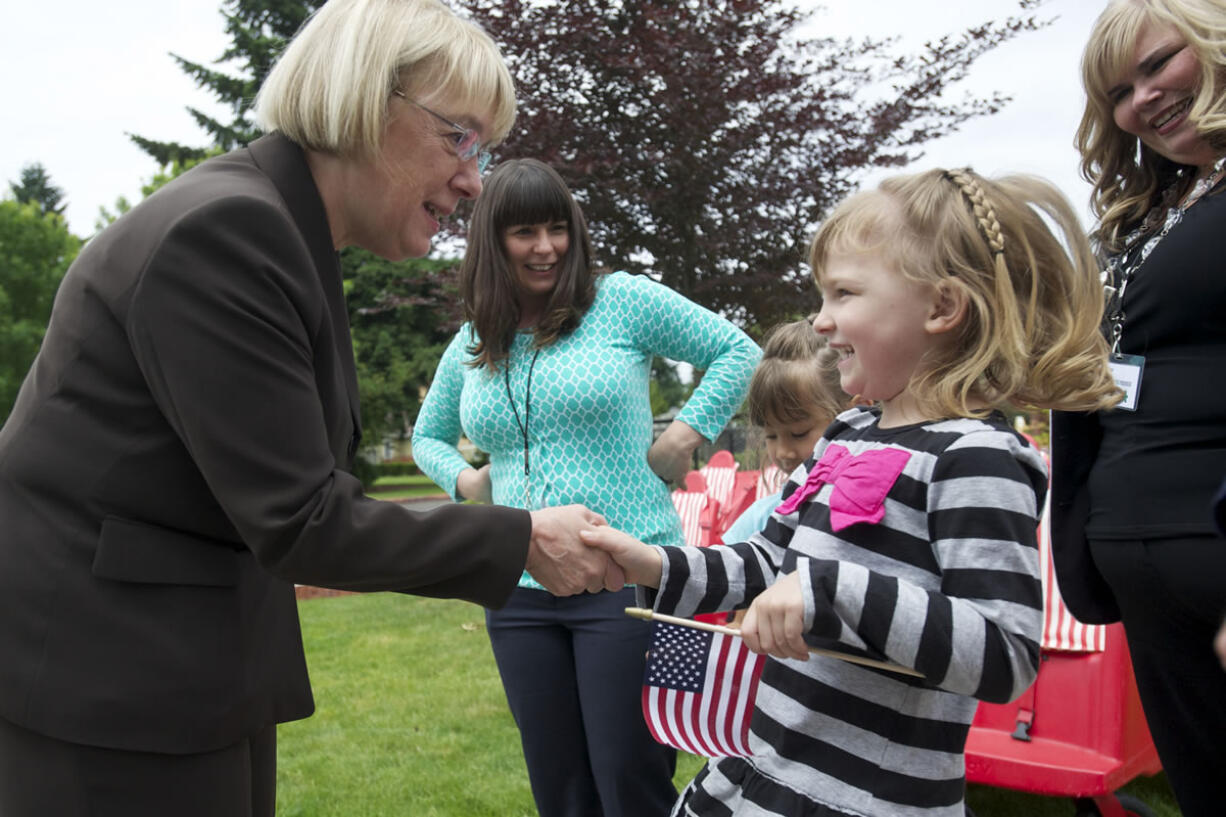 Laney Fant, 5, a student at the Patricia Nierenberg Child Care and Early Learning Center, welcomes U.S. Sen. Patty Murray, D-Wash., to the center on Friday.