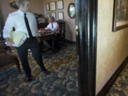 Barry Brandenburg and his son, Bennett, look over cases at Barry's downtown Vancouver office this week.