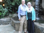 Ridgefield: Noel and Nancy Johnson of Lewis River.com posed for a Polynesian-themed photo before they snapped photos of the 100 guests at the La Center Historical Museumis gala Sept. 15 at Summit Grove Lodge.