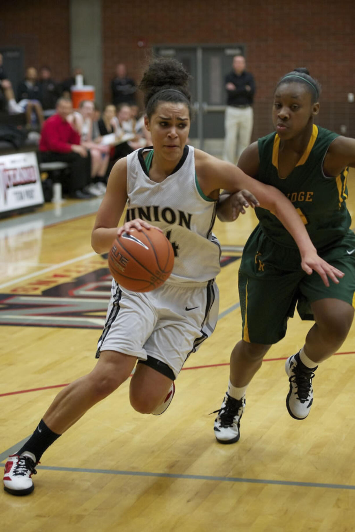 Jessica Chatman, with ball, drives to the basket against Kentridge defender Kiki Gilbert, during Union's win.