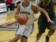 Jessica Chatman, with ball, drives to the basket against Kentridge defender Kiki Gilbert, during Union's win.