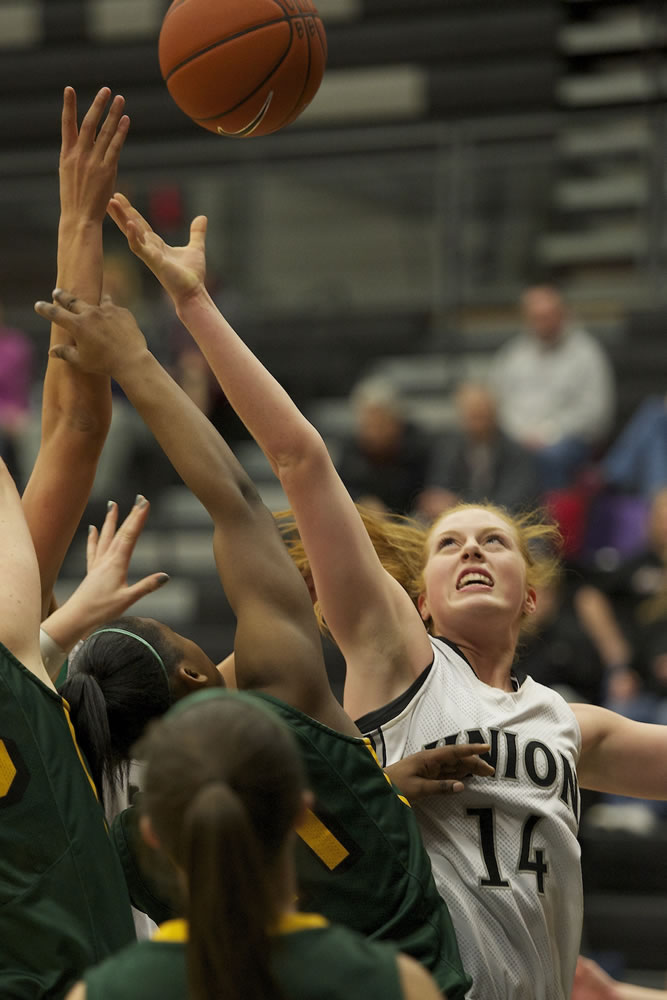 Katie Burbank (14) battles for an offensive rebound against Kentridge during a Class 4A bi-district girls basketball game Tuesday.