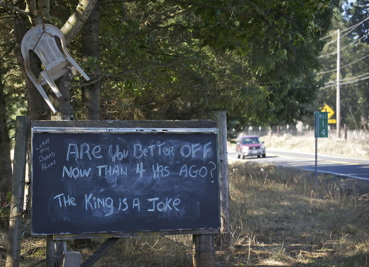 An empty chair hangs from a tree outside the Camas home of George and Kathryn Maxwell on Wednesday.